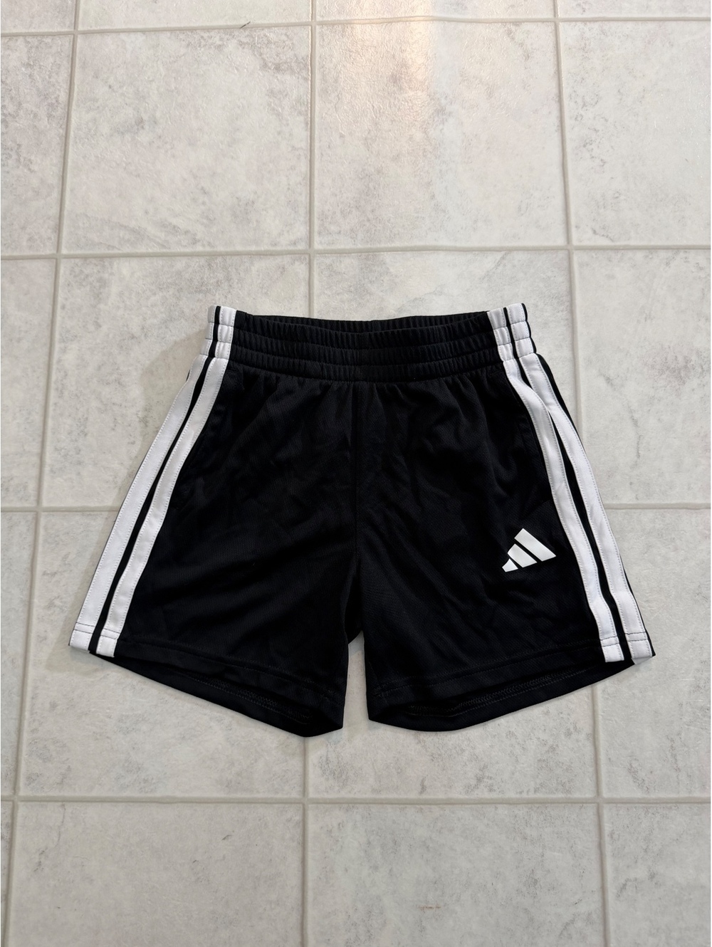 Adidas black athletic shorts with white stripes